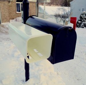 White mailbox newspaper tube